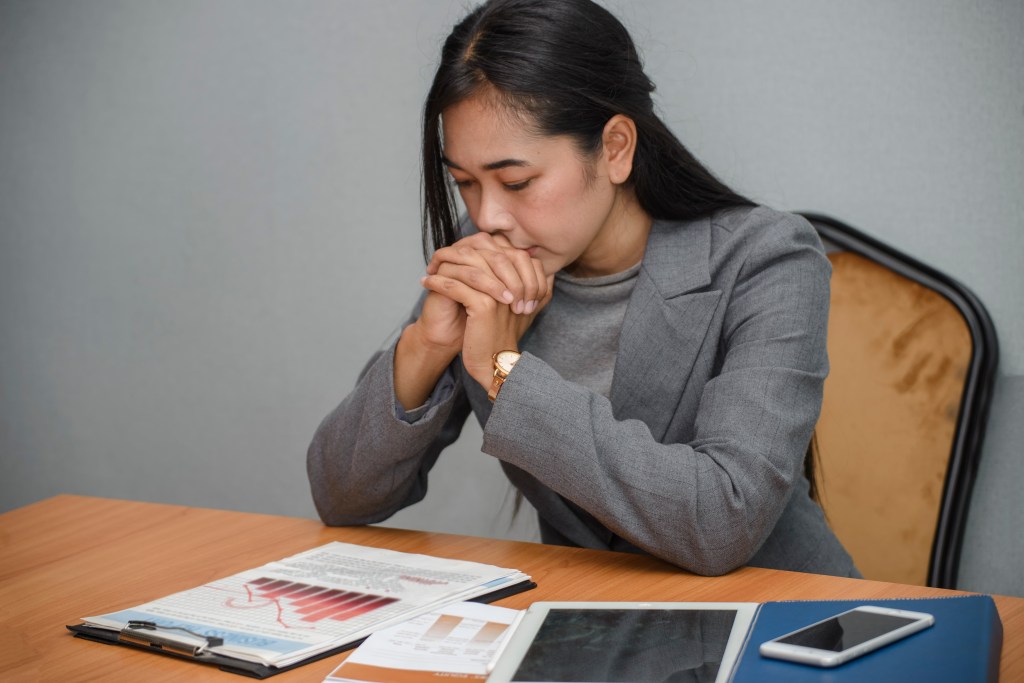 Stressed businesswoman, Frustrated and upset in business pressure and overworked at office.